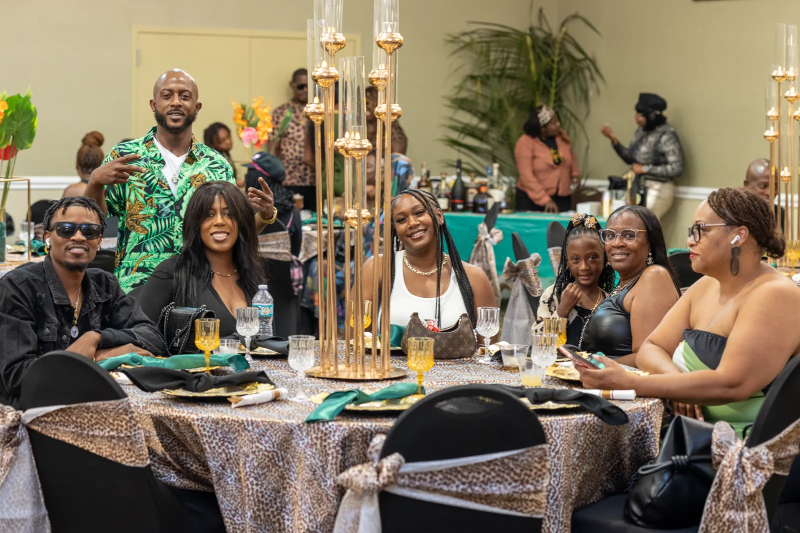 Friends and family gathered around a decorated table