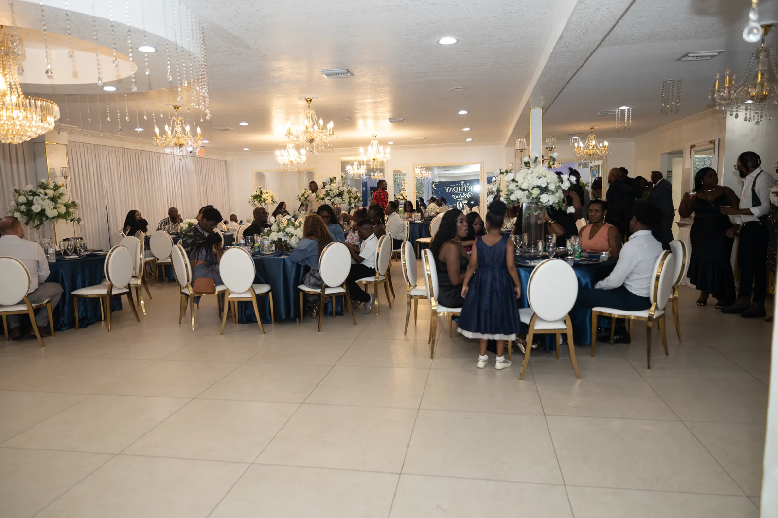 Guests filling a bright reception room